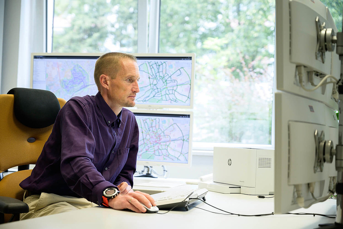 A man sitting at his desk stares at his computer