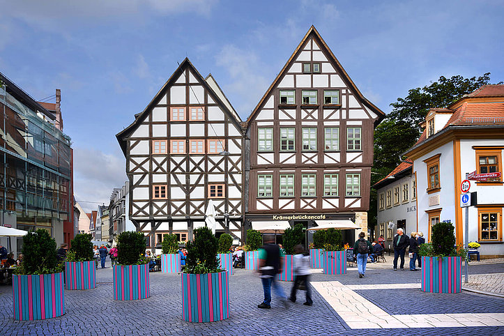 Two old half-timbered houses on the Krämerbrücke, in front of which are planted flower pots